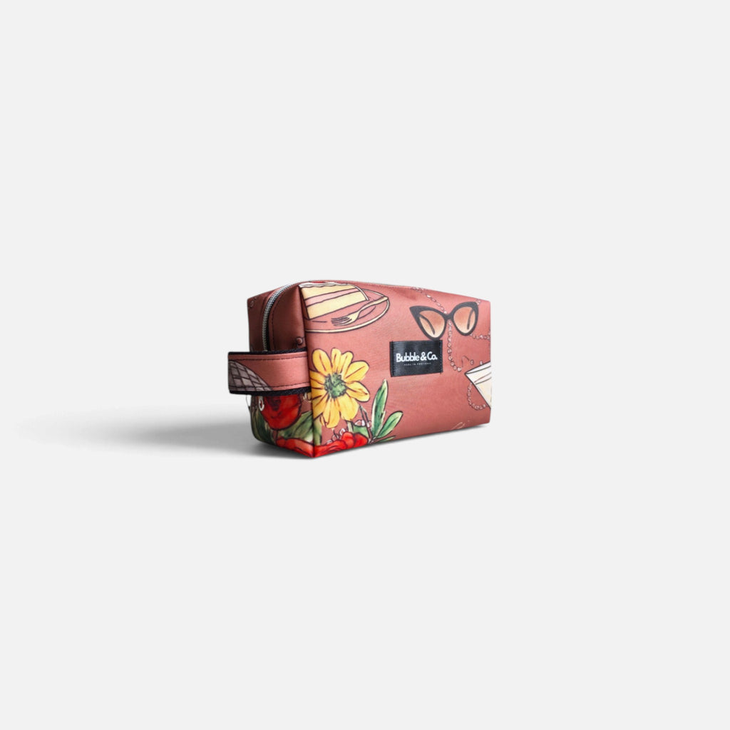 Close-up of the exclusive Her Little World print on Bubble & Co. M toiletry bag