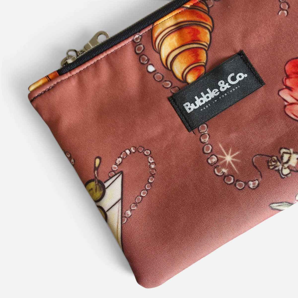 Close-up of the exclusive Her Little World print on Bubble & Co. Pouch Bag